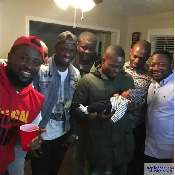 Photos: Olamide Carries Comedian Ushbebe’s Son As He Becomes His Godfather